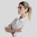 Woman in glasses with arms crossed