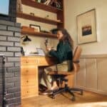 Woman working at a desk in a cozy home office